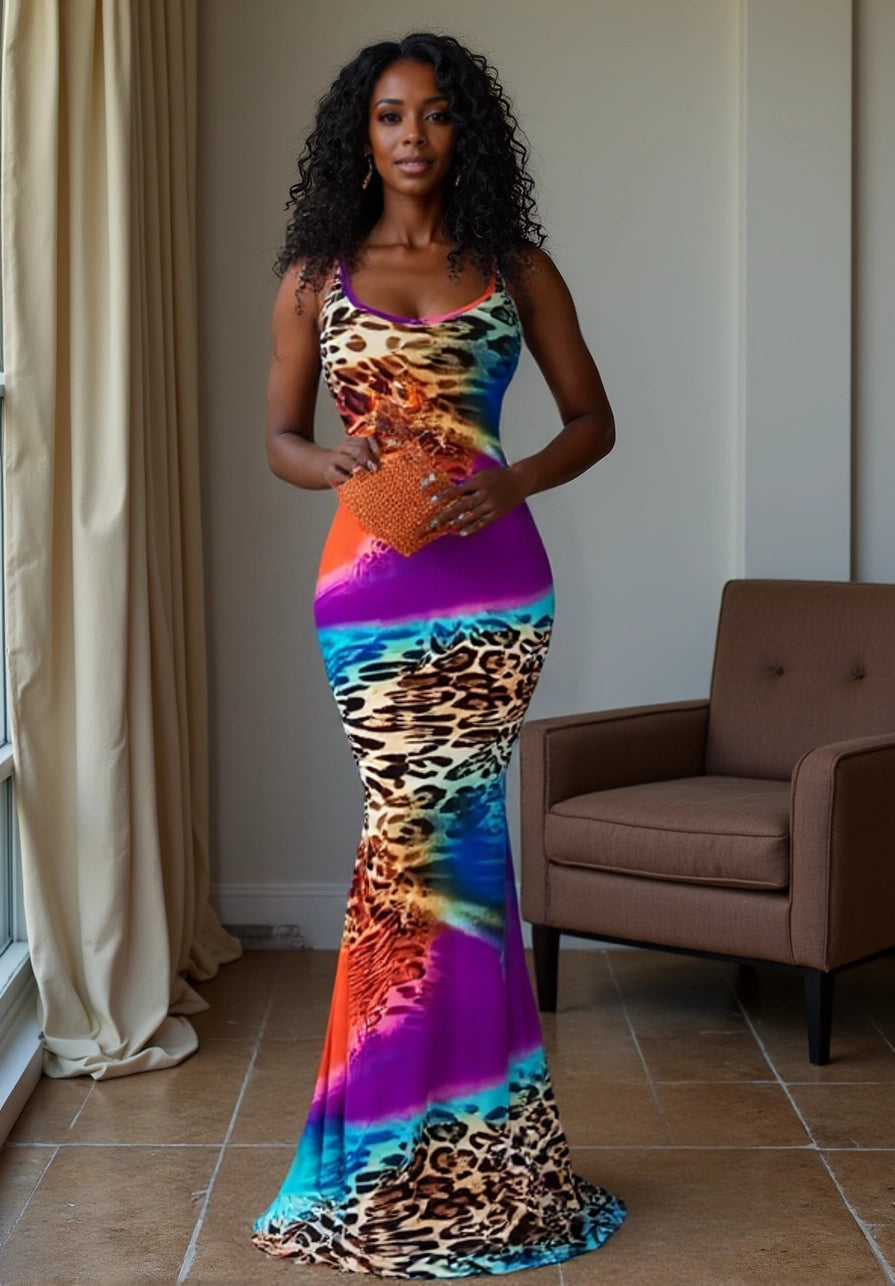 Woman wearing a colorful dress with leopard print pattern in a room.