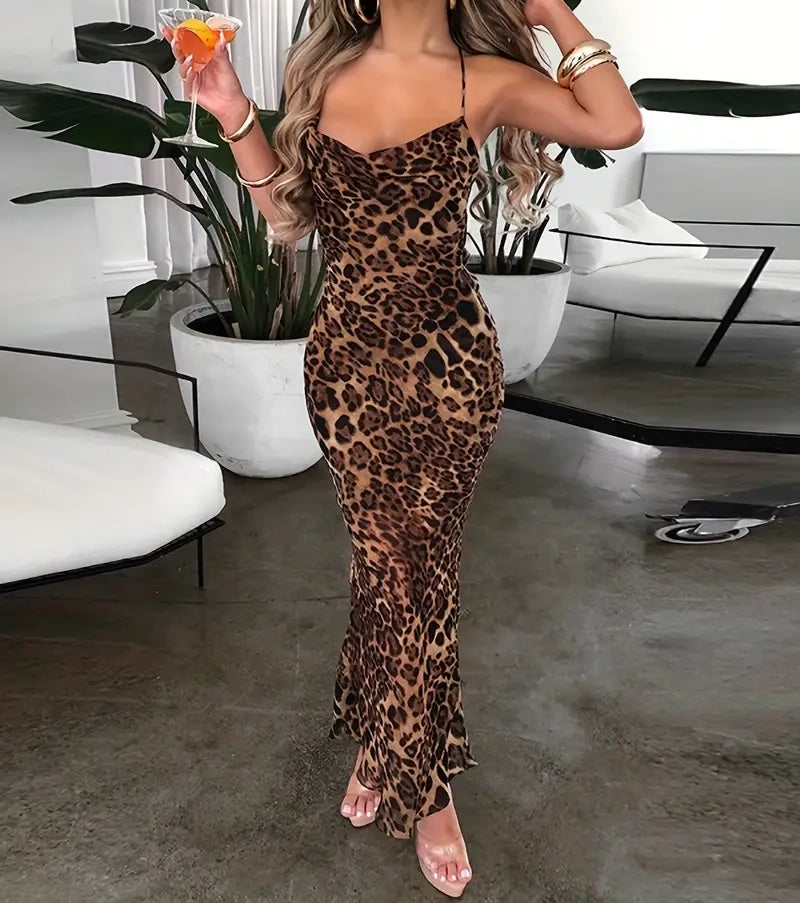 Person wearing a leopard print dress in an indoor setting