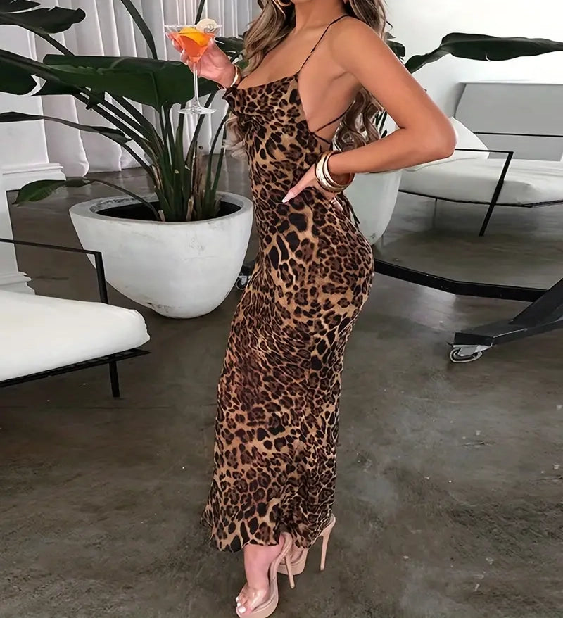 Person wearing a leopard print dress in an indoor setting