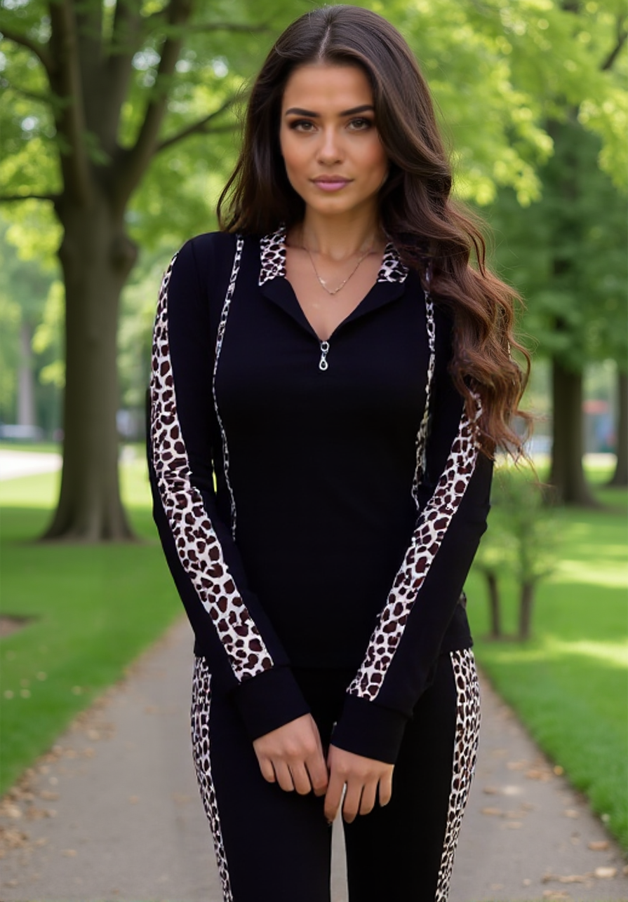 Woman wearing a black outfit with leopard print accents in a park setting