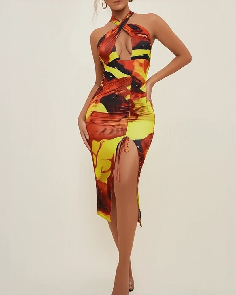 Woman wearing a colorful dress with a high slit on a plain background